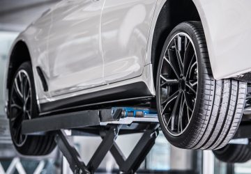 Car Repair on a Lift. Vehicle Maintenance. Automotive Technologies.